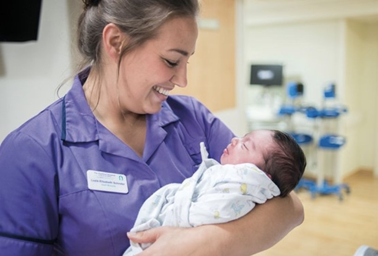 Midwife Holding Newborn